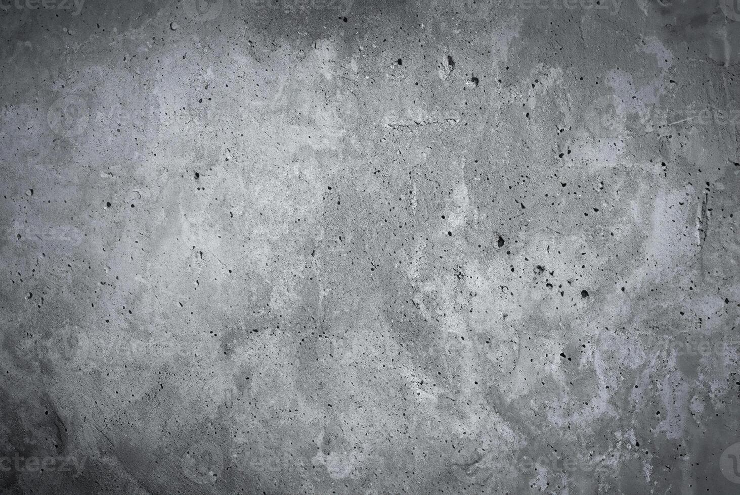 Close-up of a rough gray concrete wall texture, ideal for backgrounds or construction-related projects photo