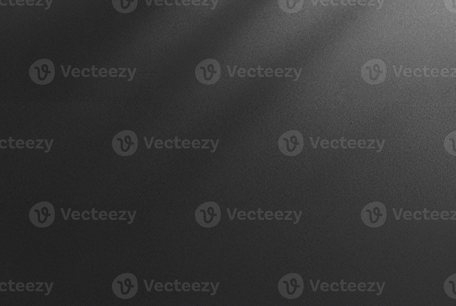Abstract dark textured black background with a soft shadow gradient, ideal for backgrounds, designs, or overlay. photo