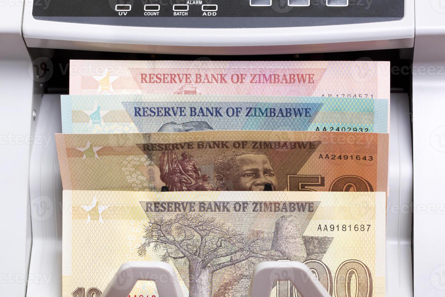 Zimbabwean dollar in the counting machine photo