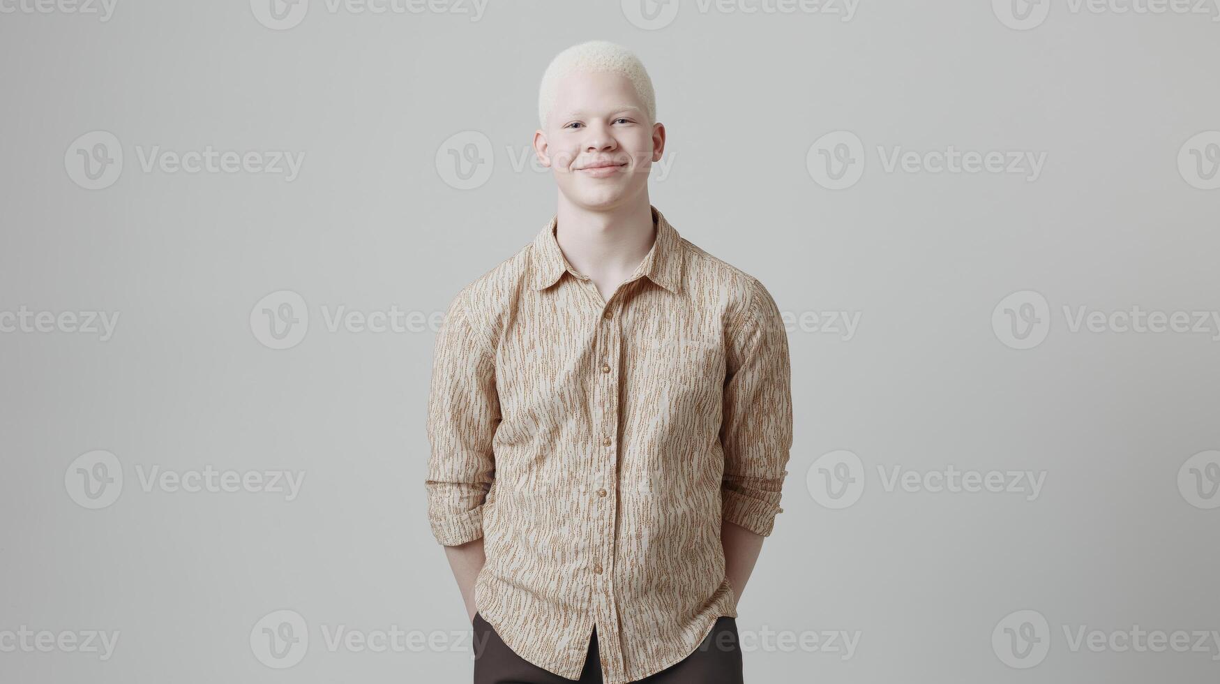 Young Hispanic Man with Albinism in Casual Attire, Studio Portrait for Inclusivity and Diversity Concepts in Media photo