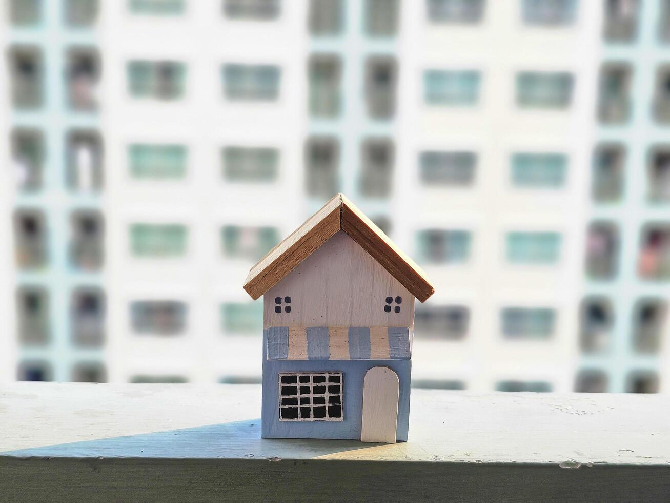 house model blurred background balcony and windows of apartment building. Finance and real estate concept. photo