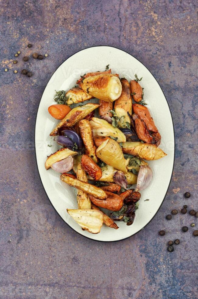 Delicious roasted root vegetables for dinner. photo