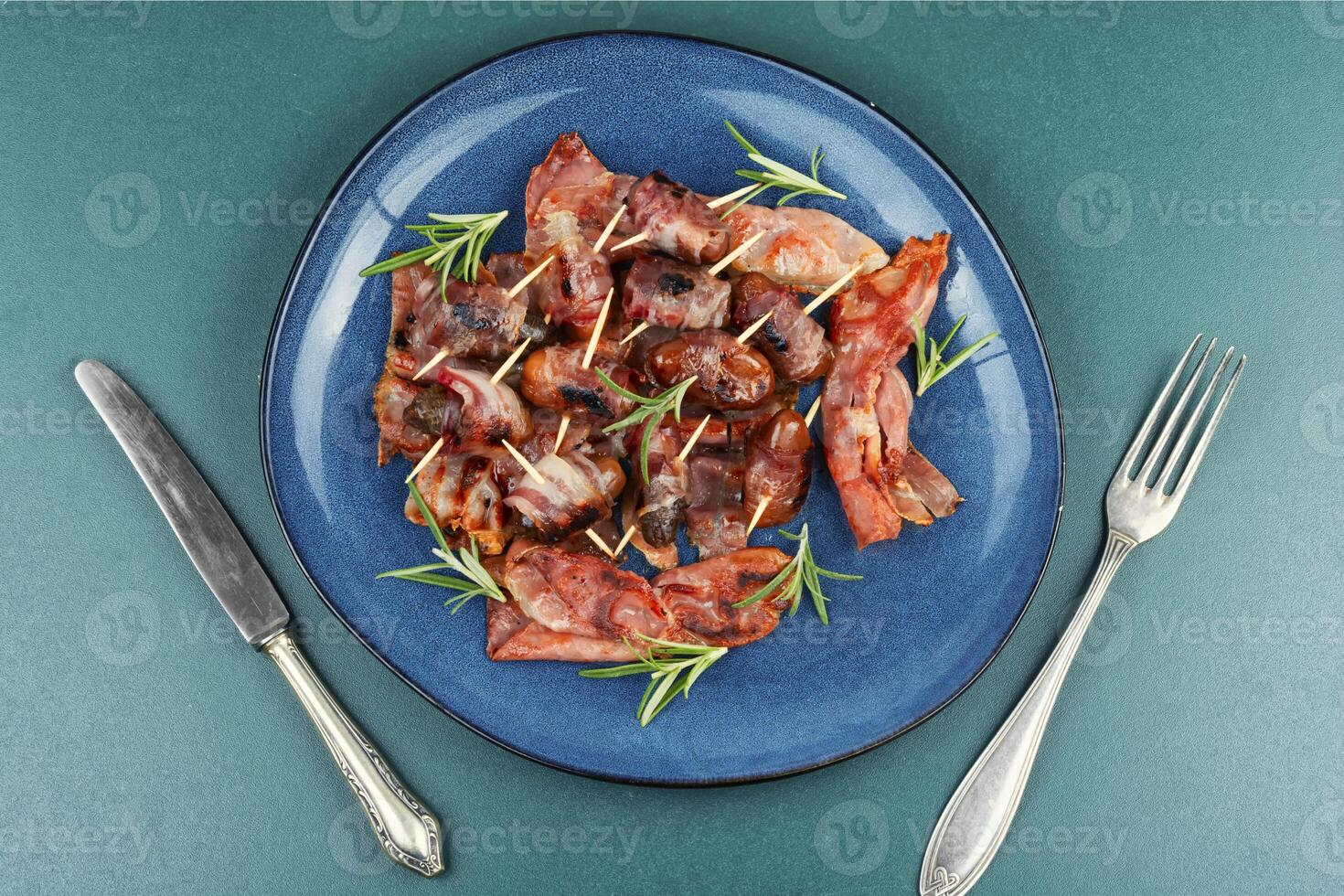Dates in bacon. photo