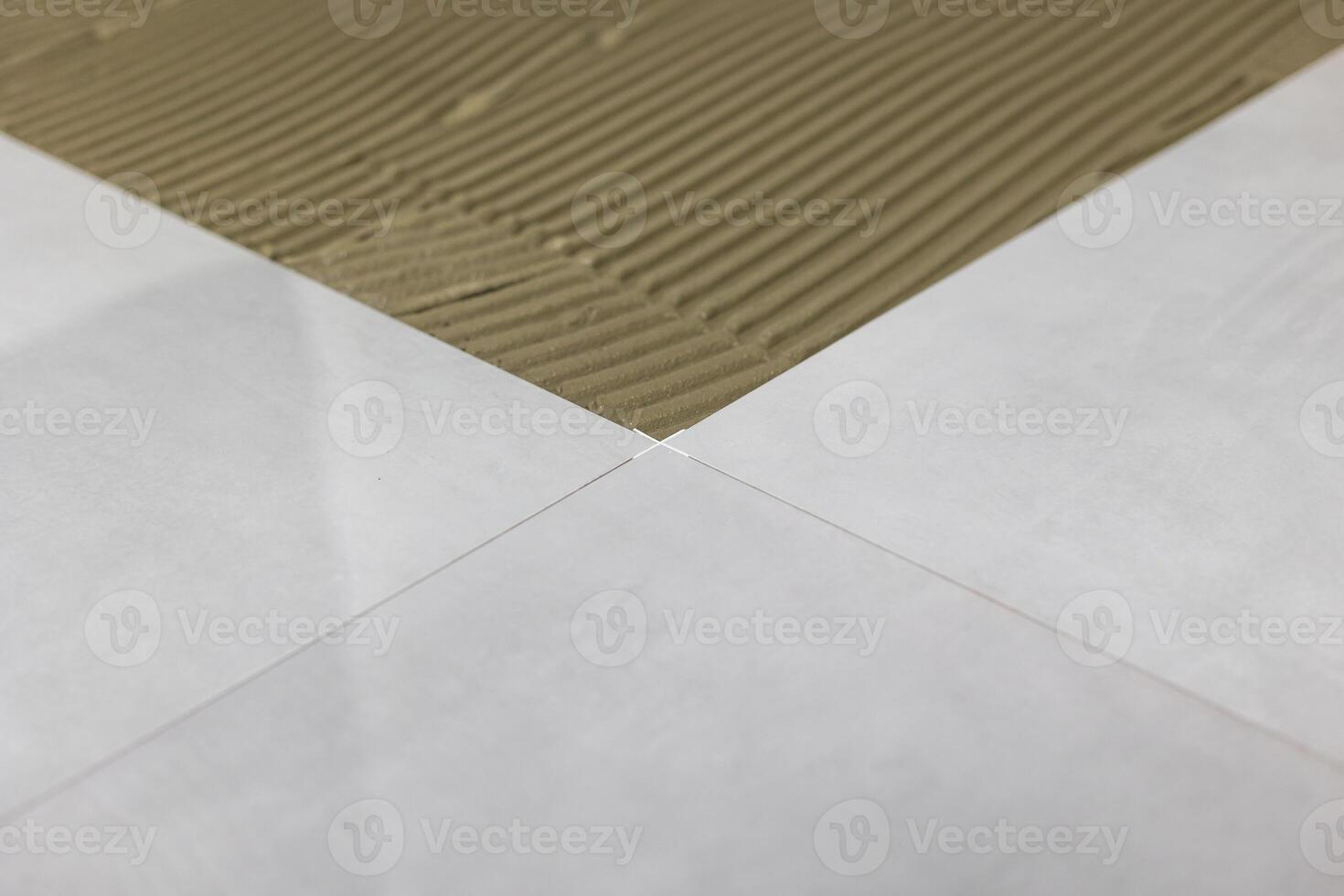 Detail of clips or spacers in the lash tile leveling system, renovation or reconstruction concept photo