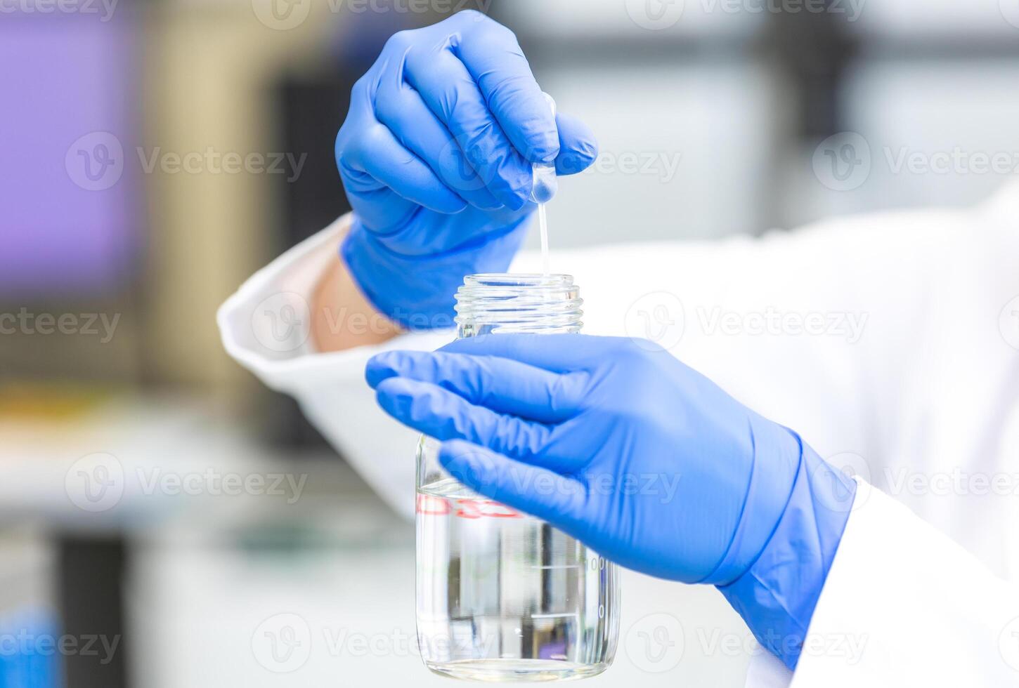 Young woman scientist holding test tube with lab glassware, science laboratory research and development concept, laboratory research photo