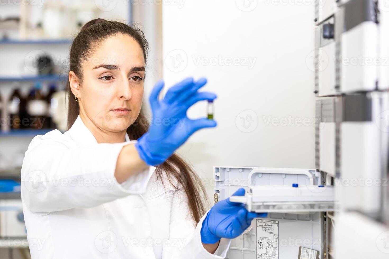 Young woman scientist in a research laboratory creating a scientific experiment, laboratory concept photo