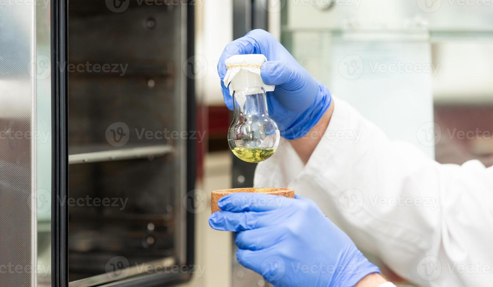 Young scientist in a research laboratory creating a scientific experiment, laboratory concept photo