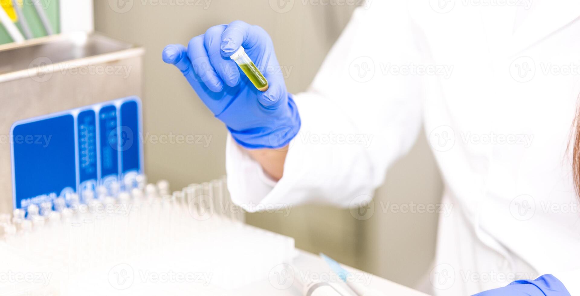 Young woman scientist holding test tube with lab glassware, science laboratory research and development concept, laboratory research photo