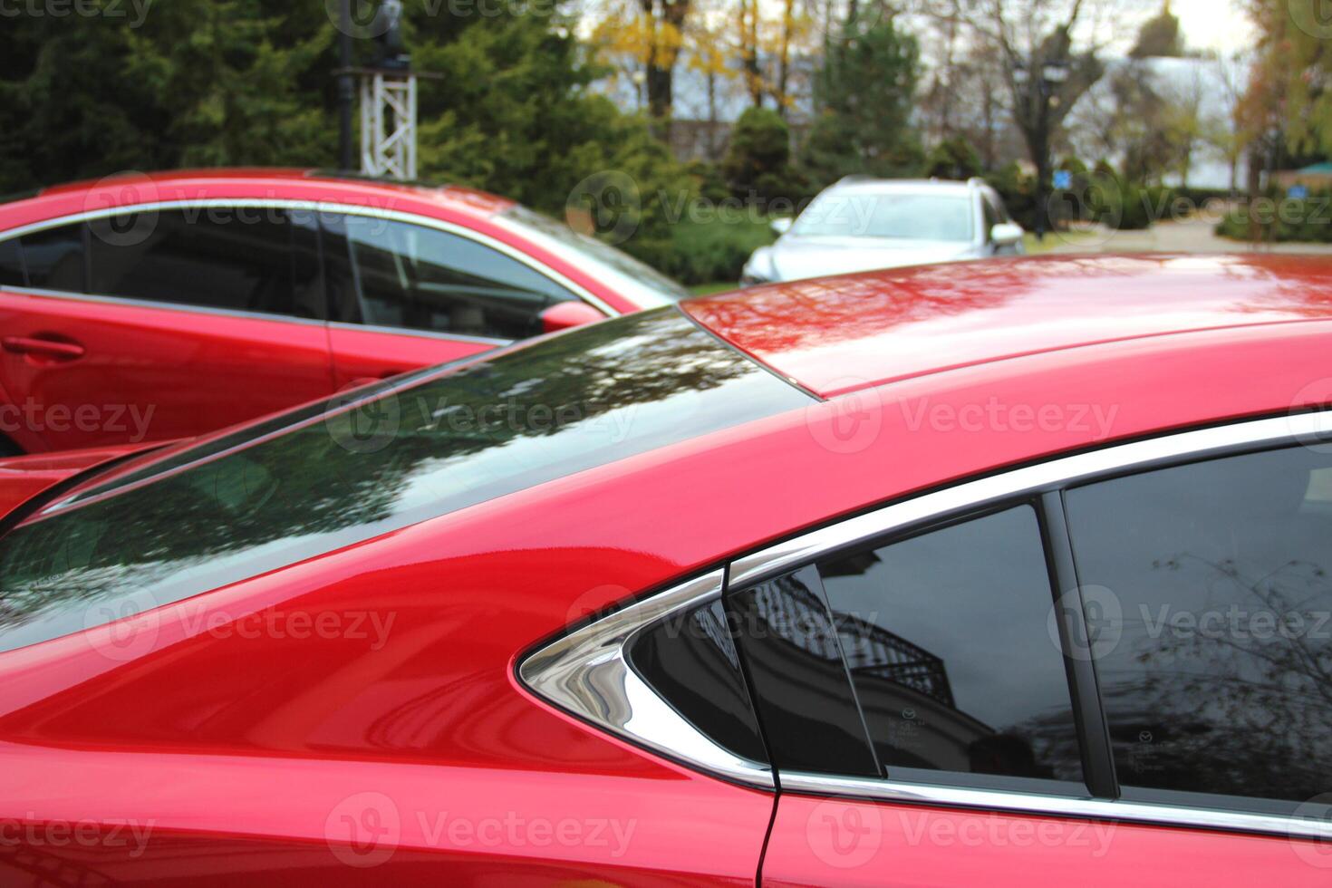 Vehicles On The Open Air Public Car Park At Evening Time photo