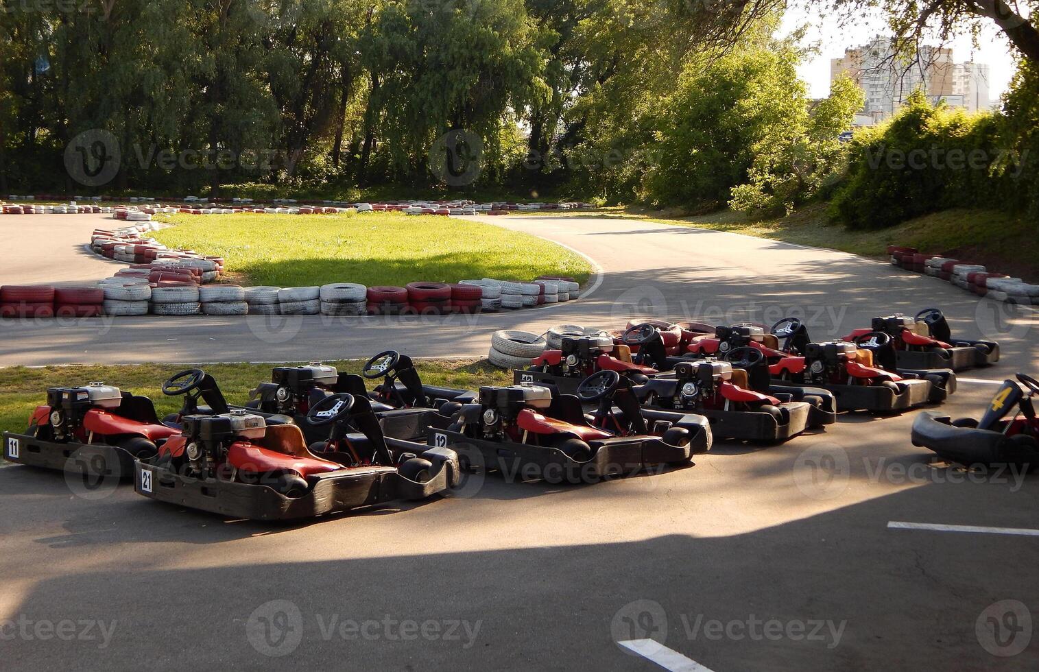 Karts Lined Up In Order At The Start Of The Go-karting Circuit photo