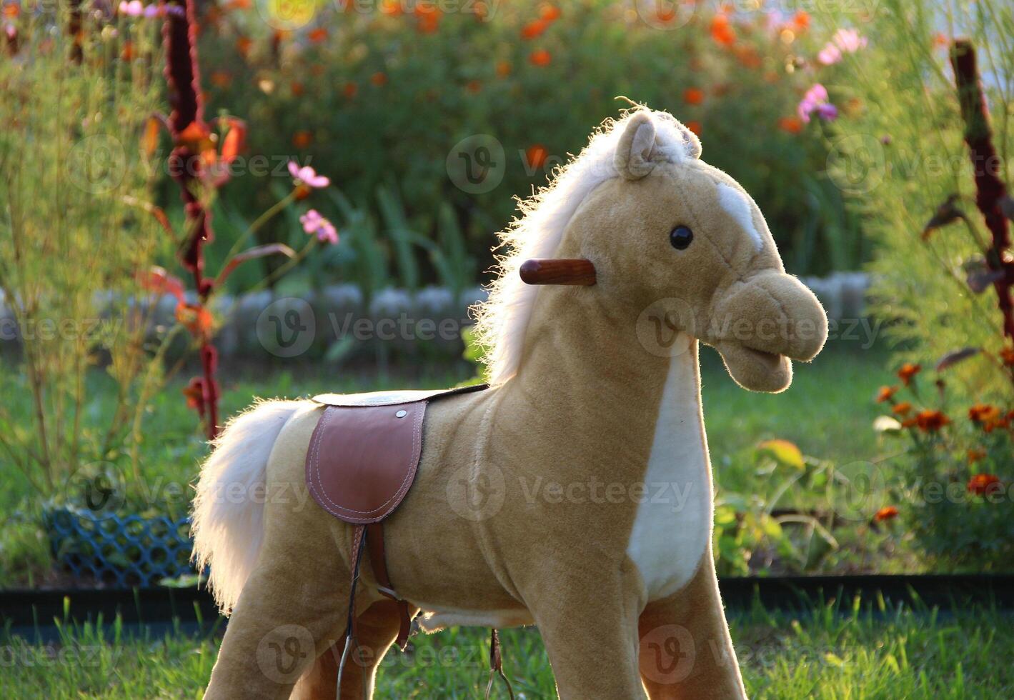 Toy Rocking Horse On A Lawn In The Yard Of Private House photo