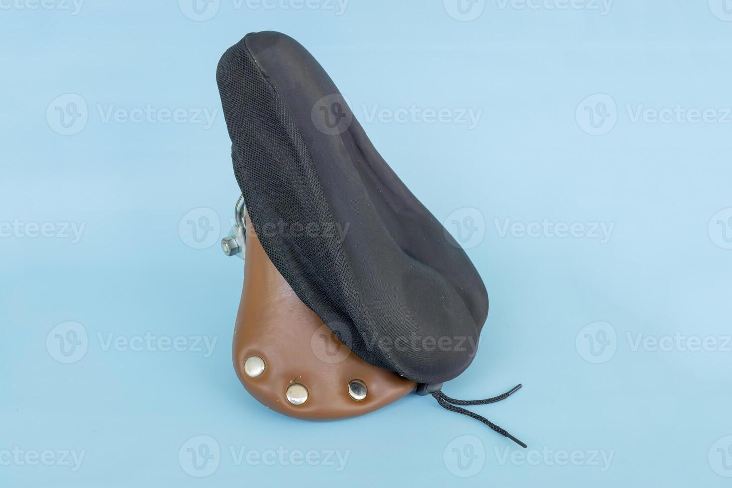 bicycle saddle cover, part of a bicycle, isolated on blue background photo