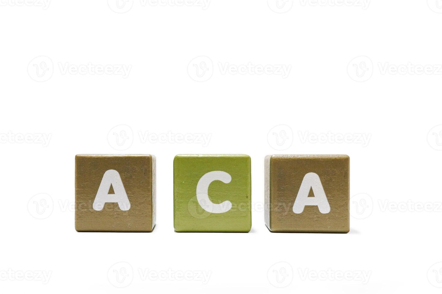 ACA Affordable Care Act text on wooden cubes isolated on a white background. photo