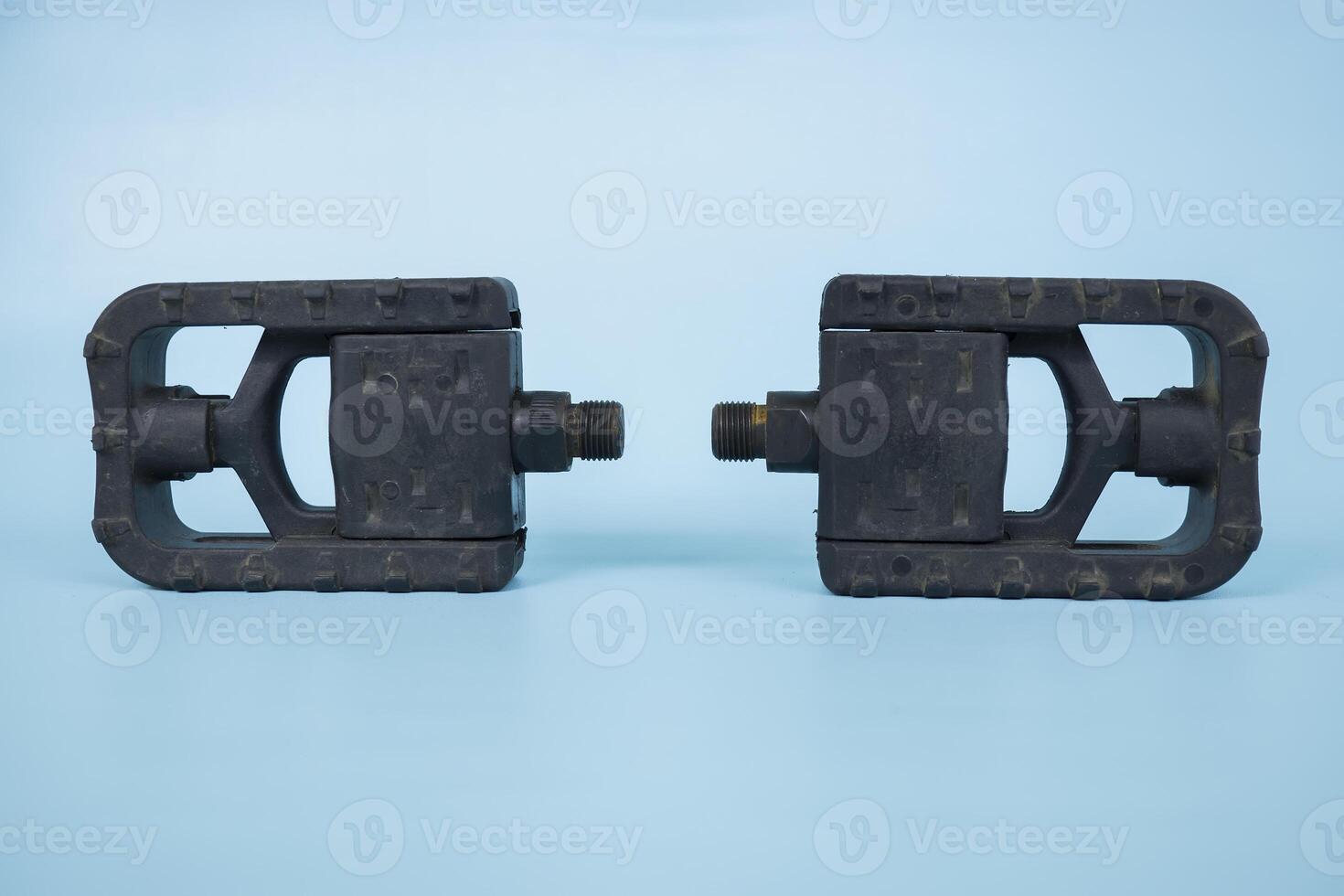 folding bicycle pedals, part of a folding bicycle, isolated on blue background photo