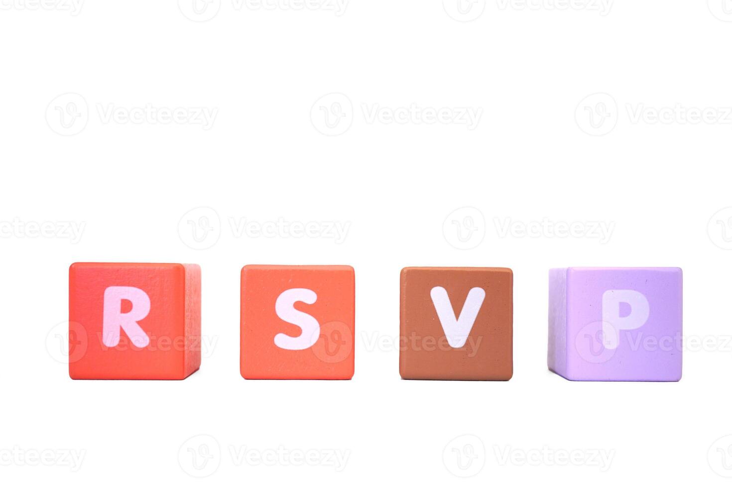 The word RSVP is made with colorful building blocks isolated on a white photo