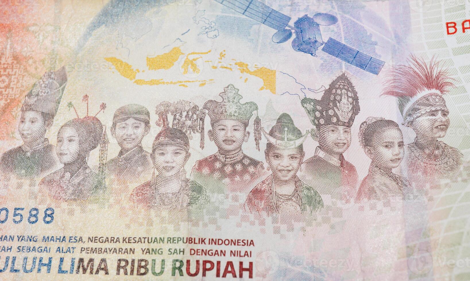Rupiah closeup, Indonesian children as the nation's next generation who are ready to welcome Indonesia forward on seventy-five thousand rupiah banknotes. photo