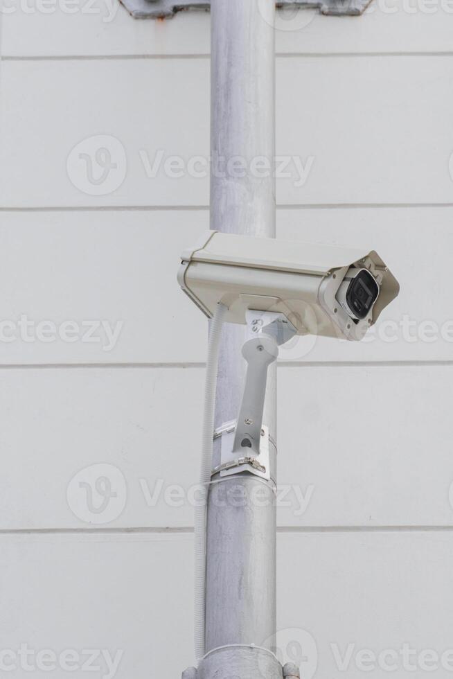 CCTV cameras on metal poles so as not to damage building walls to monitor, observe and record incident evidence for crime investigation and prevention. photo