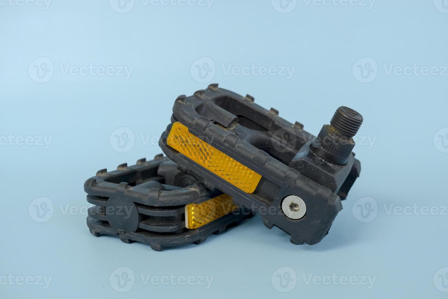 folding bicycle pedals, part of a folding bicycle, isolated on blue background photo
