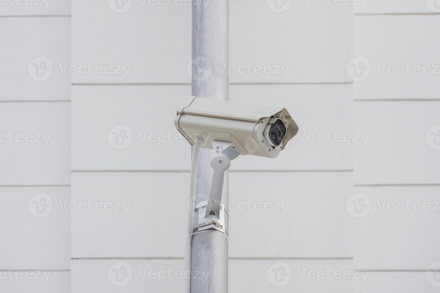 CCTV cameras on metal poles so as not to damage building walls to monitor, observe and record incident evidence for crime investigation and prevention. photo