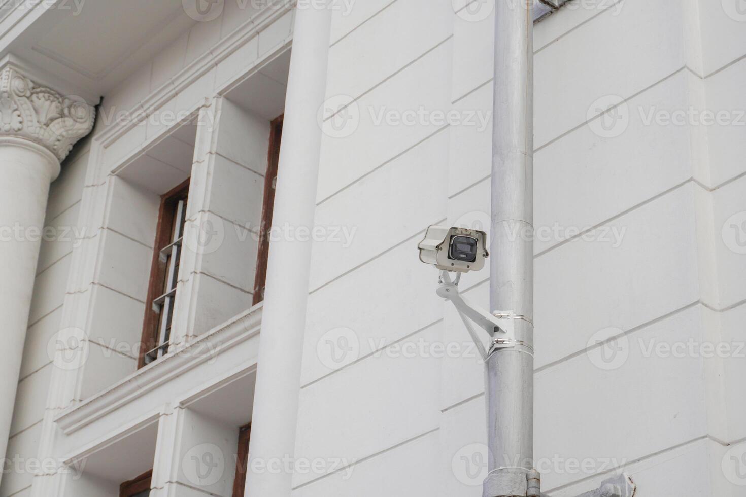 CCTV cameras on metal poles so as not to damage building walls to monitor, observe and record incident evidence for crime investigation and prevention. photo