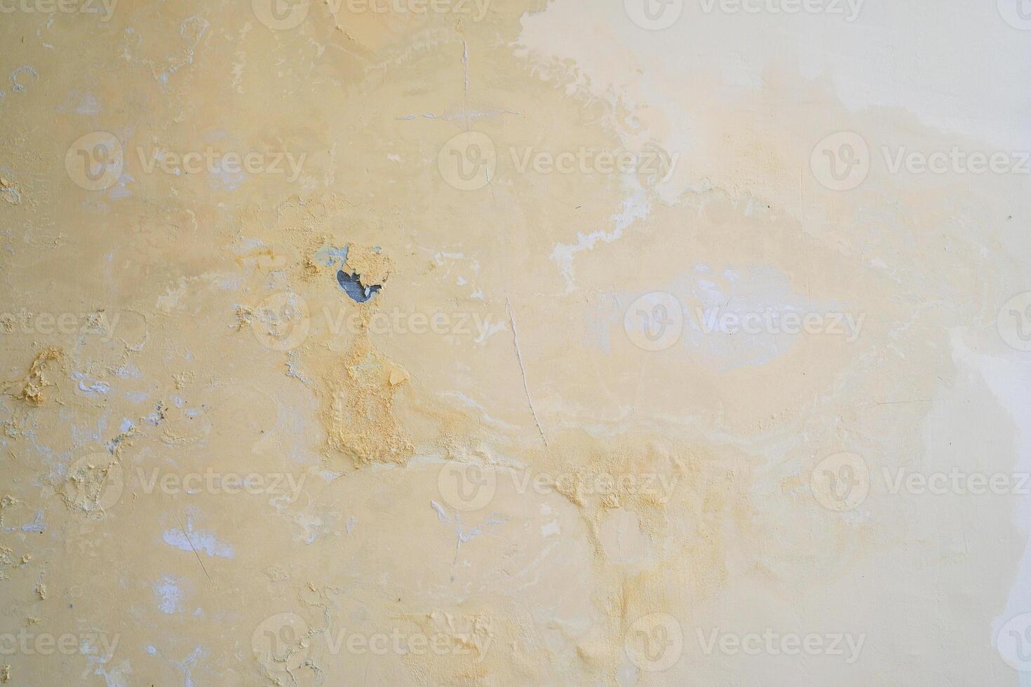 Water seeps into the walls of leaking pipes, causing water stains and peeling paint photo