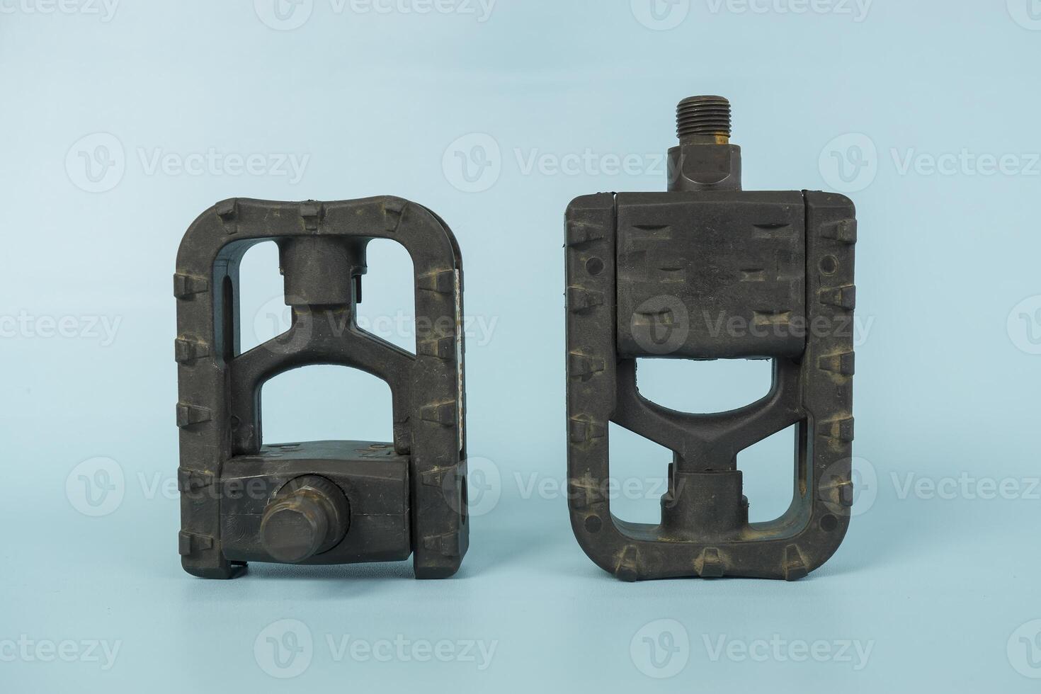 folding bicycle pedals, part of a folding bicycle, isolated on blue background photo