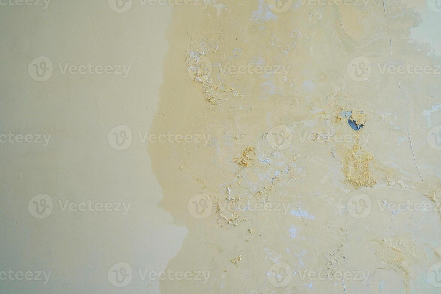 Water seeps into the walls of leaking pipes, causing water stains and peeling paint photo