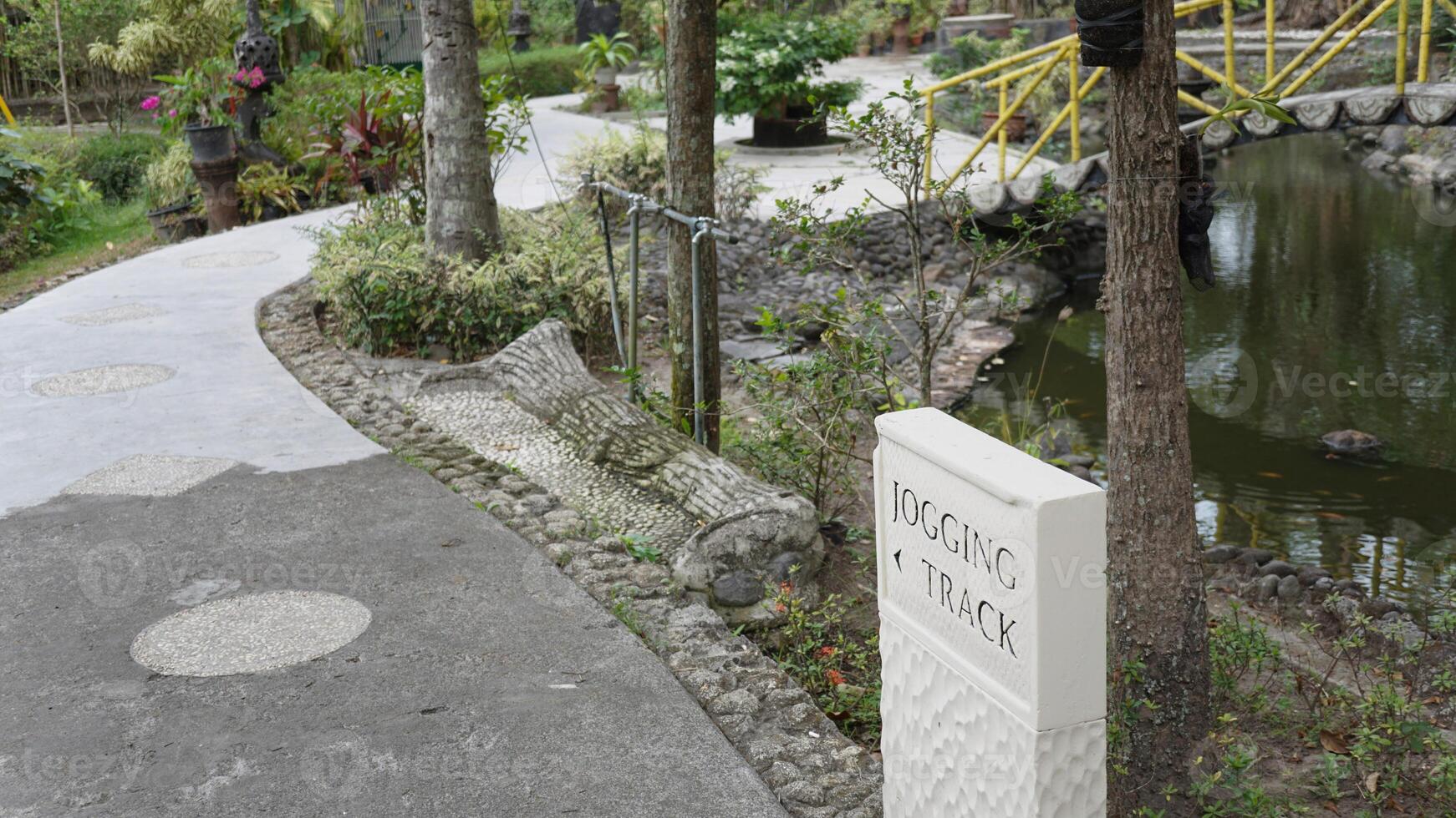 Large square stone information sign with black letters to show directions. photo
