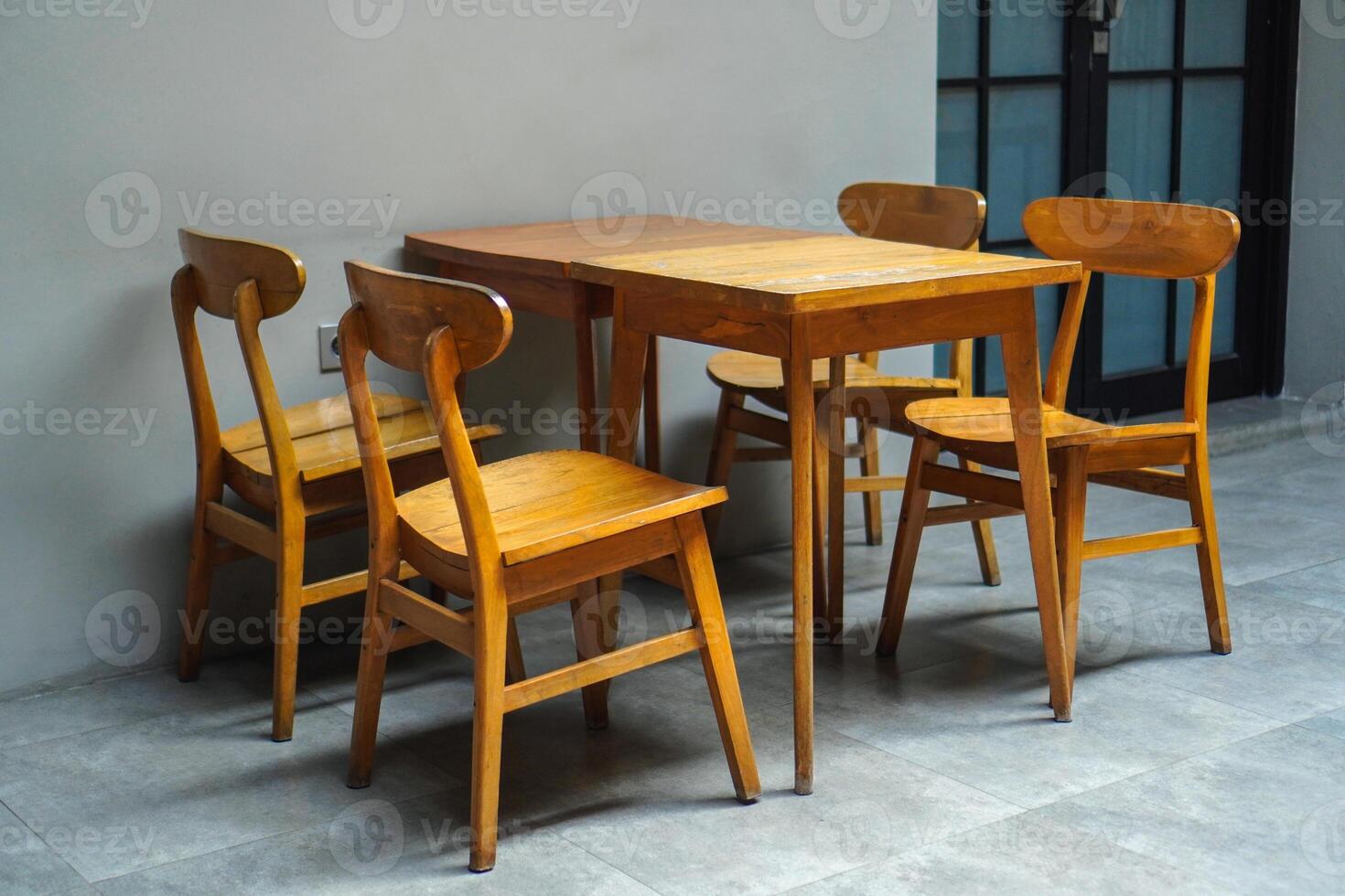 simple minimalist wooden table and chairs for sitting and drinking coffee in a coffee shop photo