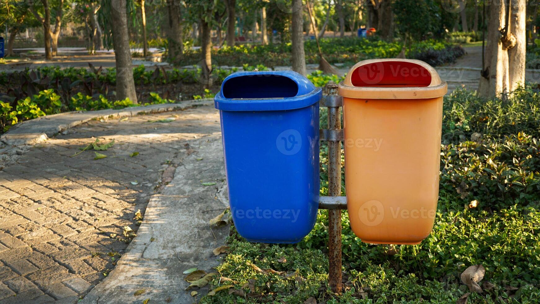 trash cans used to accommodate organic and non-organic waste from city parks photo