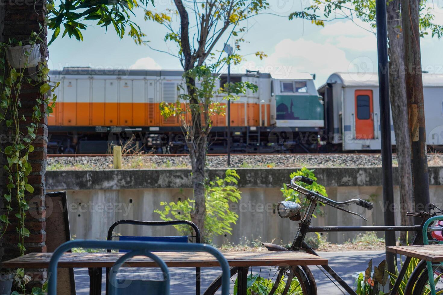 cafe with an antique concept with views of the village and passing trains photo