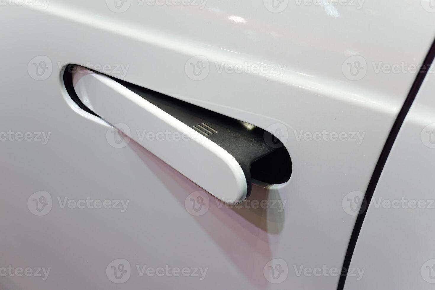 close up of modern car door handle without keyhole or keyless photo
