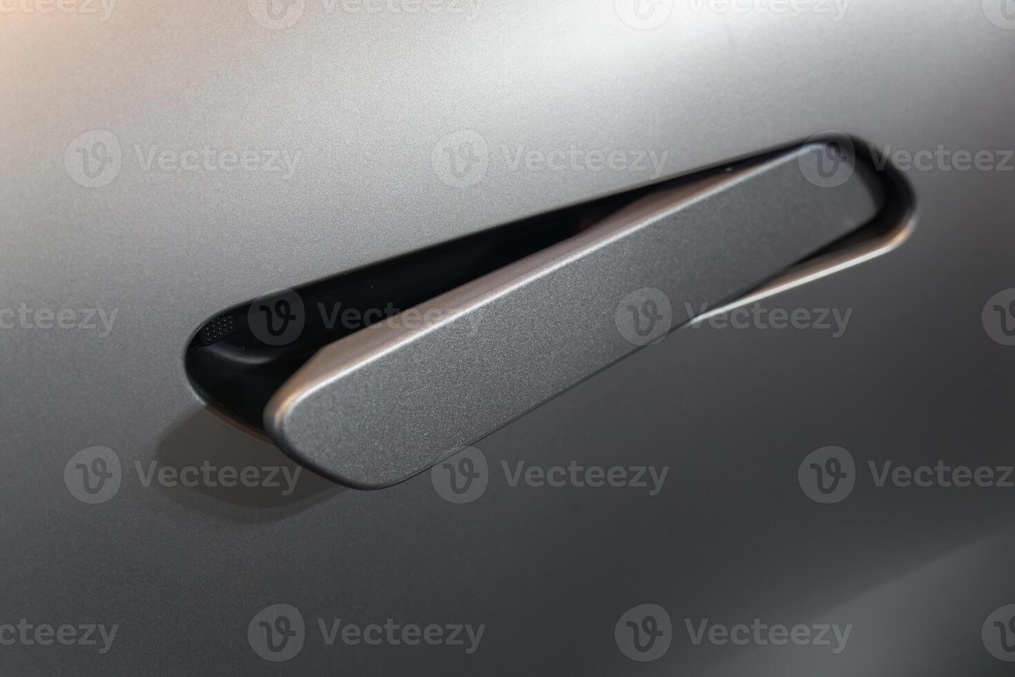 close up of modern car door handle without keyhole or keyless photo