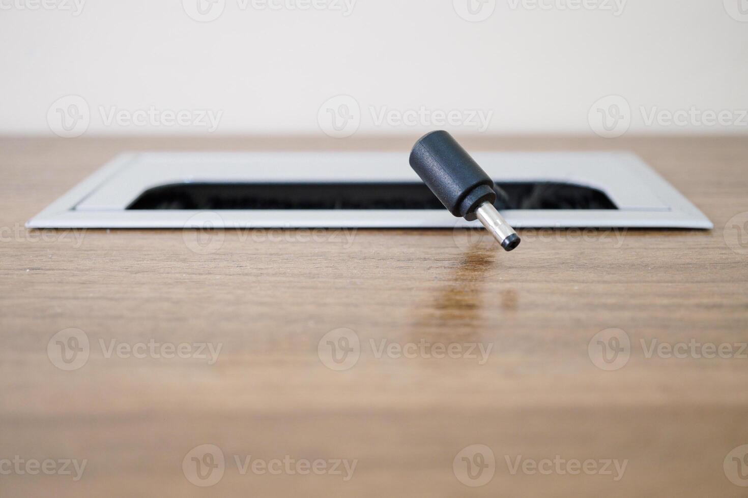 close up, office work desk that has a cable hole photo