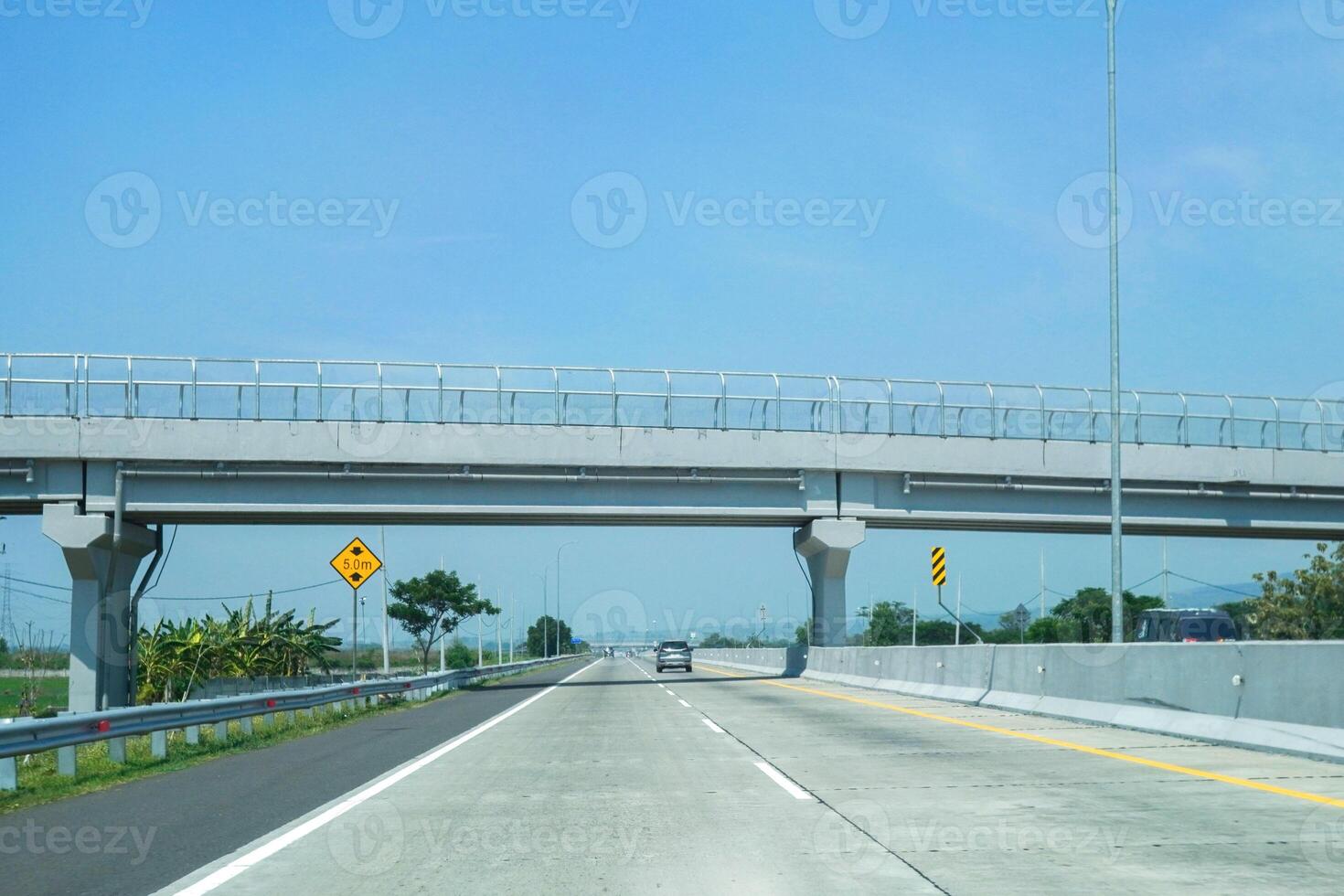 public bridge that passes the toll road below photo