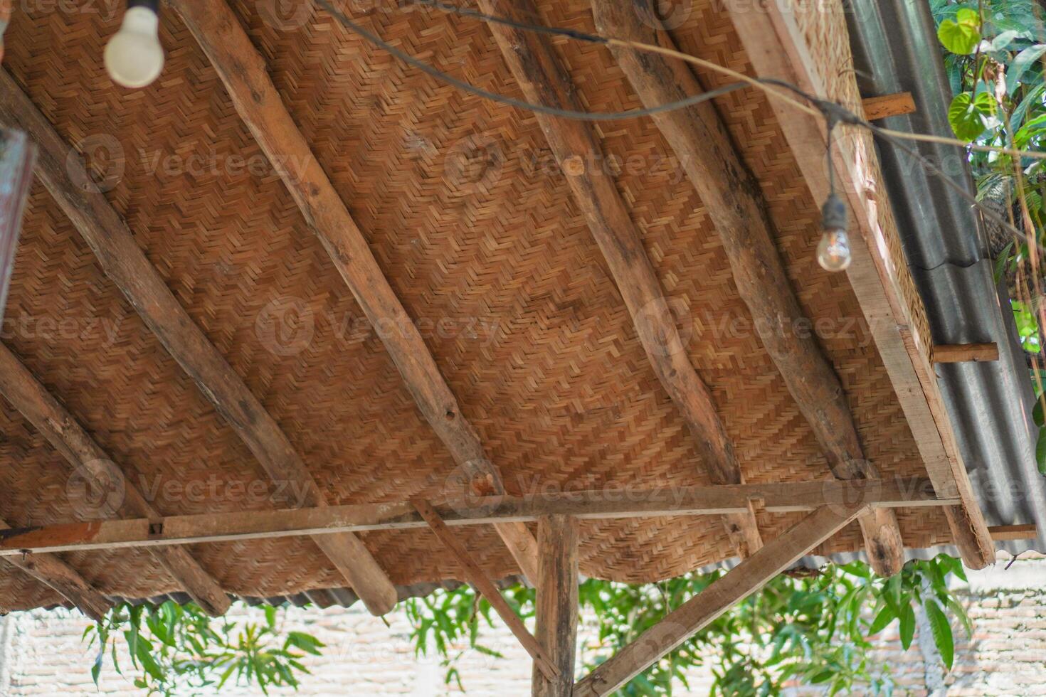 Natural roofing material is made from bamboo woven by artisans. photo