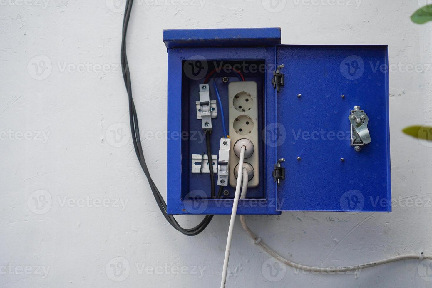Electrical circuit breaker and socket, inside aluminum steel cabinet photo
