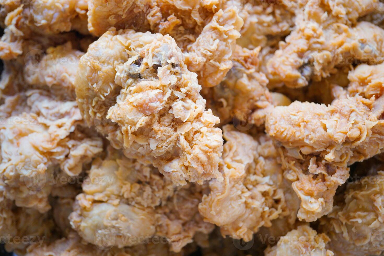 a pile of delicious homemade crispy fried chicken arranged randomly photo