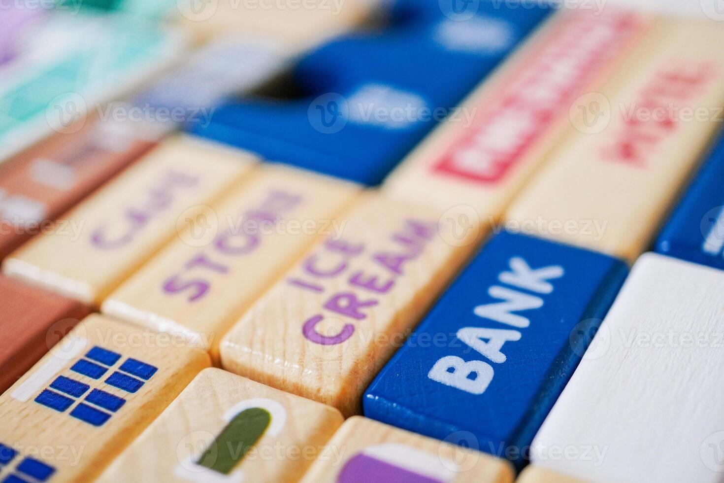 The wooden building blocks are painted colorful and focus on the words bank photo