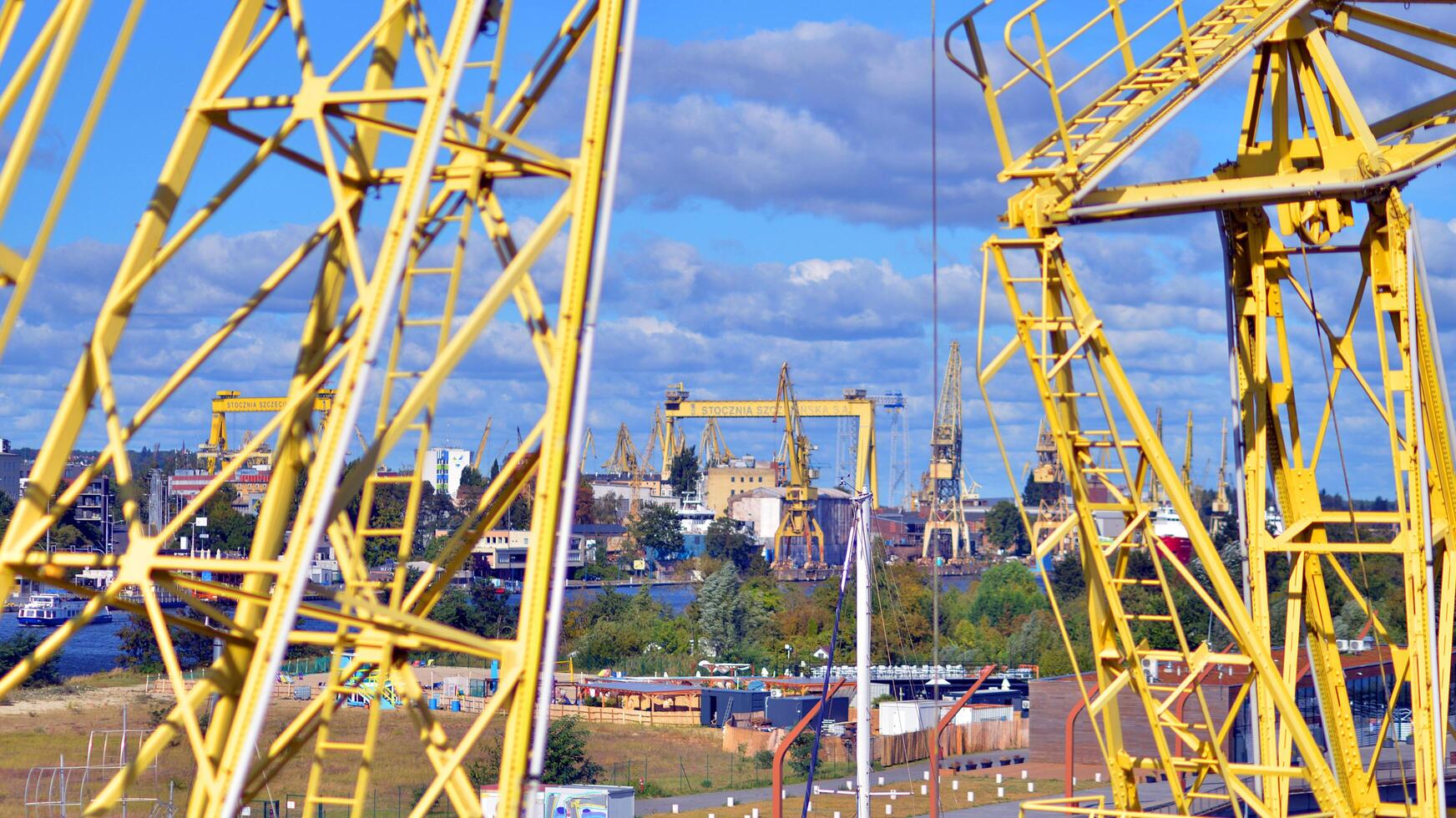 Szczecin, Poland. 14 September 2024. Landscape view and ships on the Odra river and old cranes photo