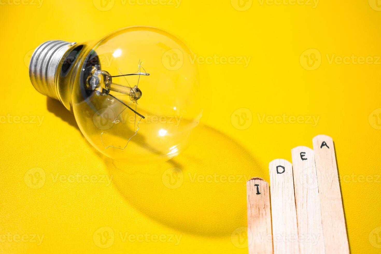 stick of ice cream with the words Idea and lightbulb. Motivational quotes, optimism, positive words. Isolated on background photo