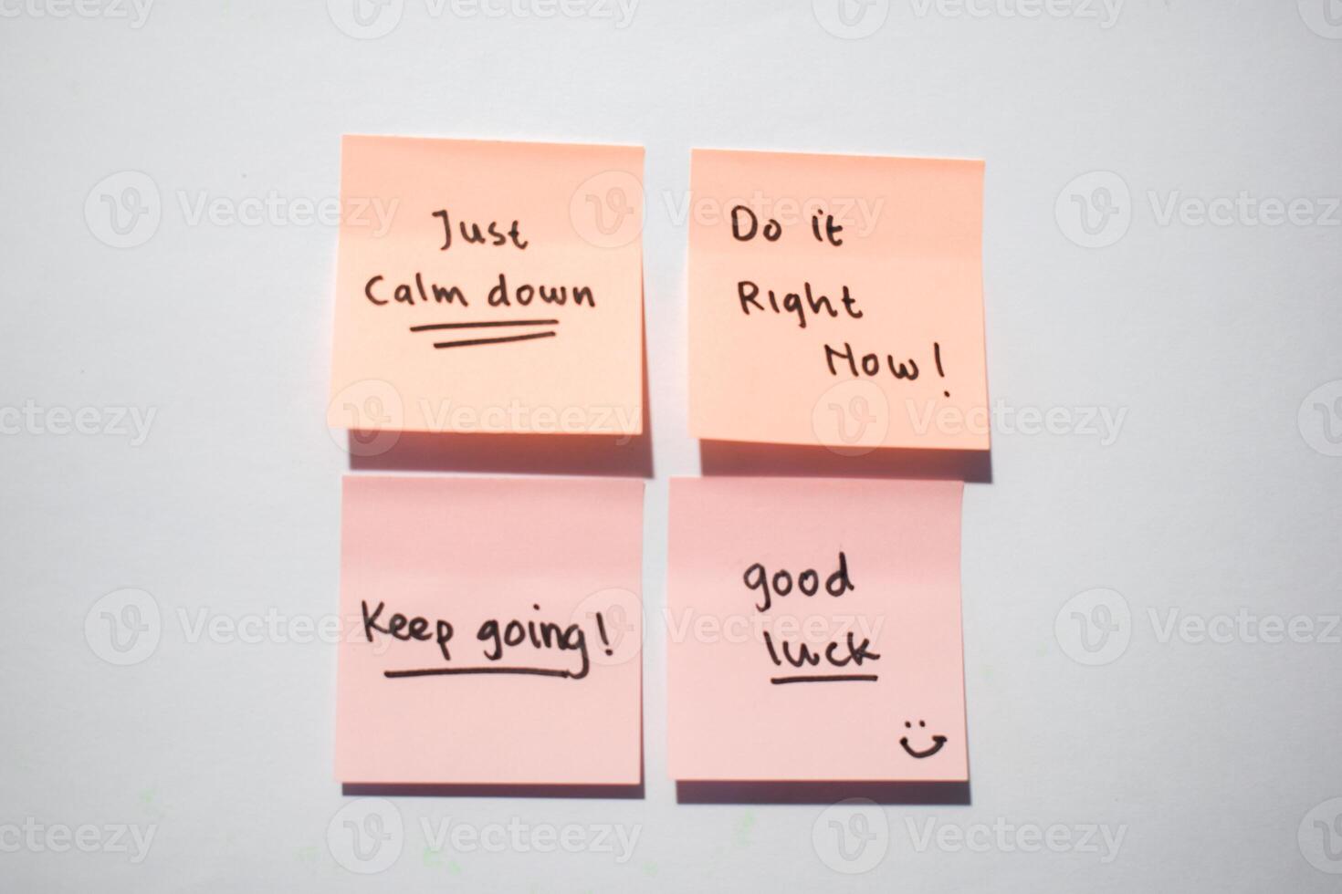 Just calm down, keep going, good luck on sticky notes. Motivational for personal development, inspirational handwriting. Isolated background photo