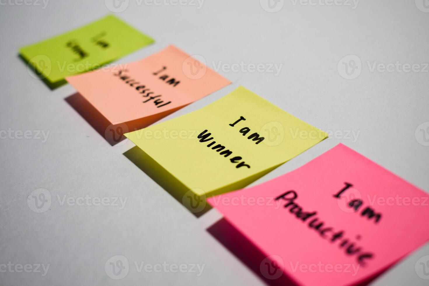 I am winner on sticky notes. Motivational words for personal development, inspirational handwriting. Isolated background photo