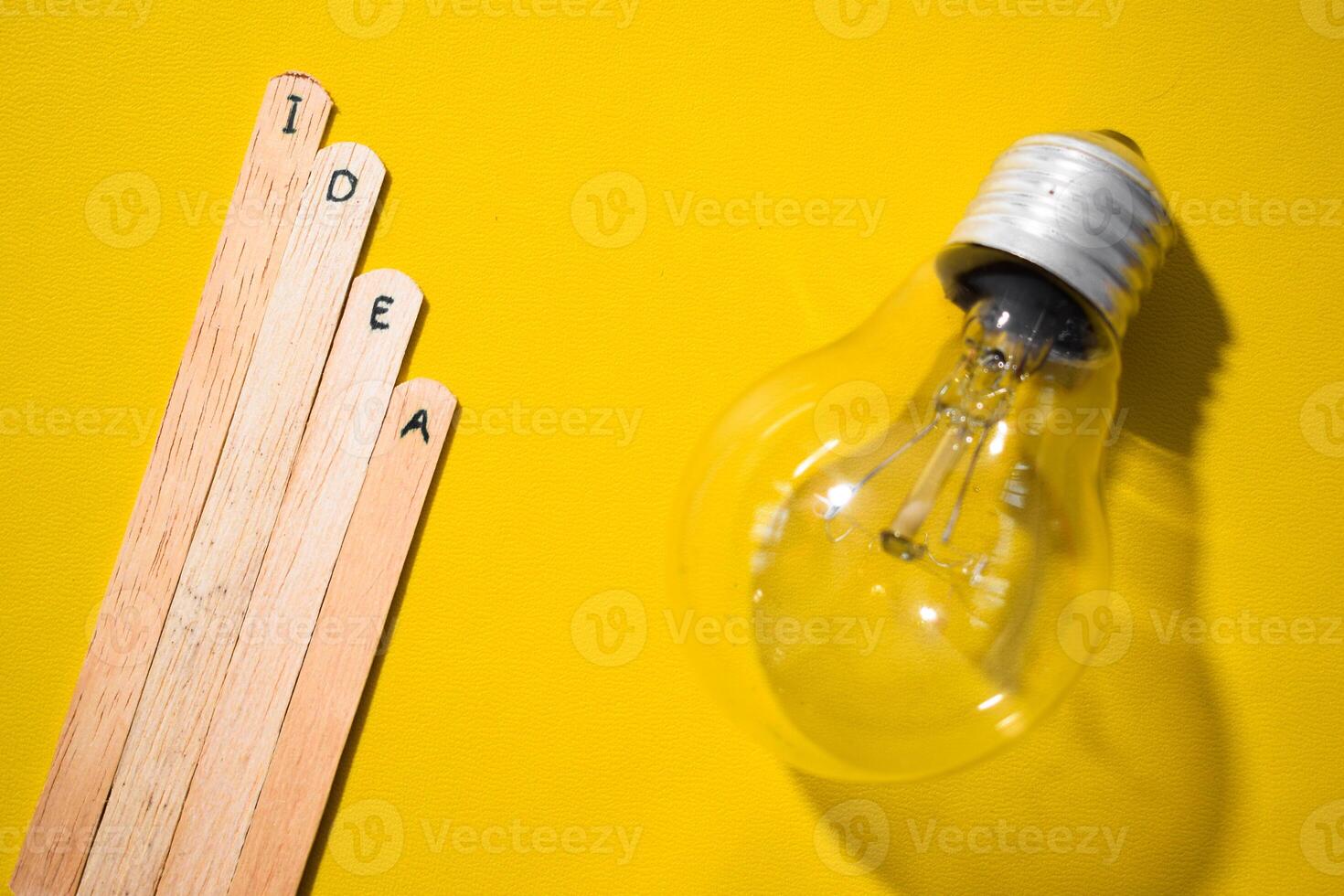 stick of ice cream with the words Idea and lightbulb. Motivational quotes, optimism, positive words. Isolated on background photo