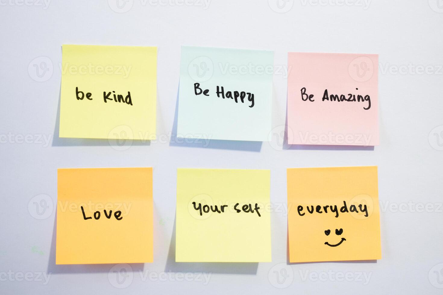 Be kind, be happy,be amazing on sticky notes. Motivational for personal development, inspirational handwriting. Isolated background photo