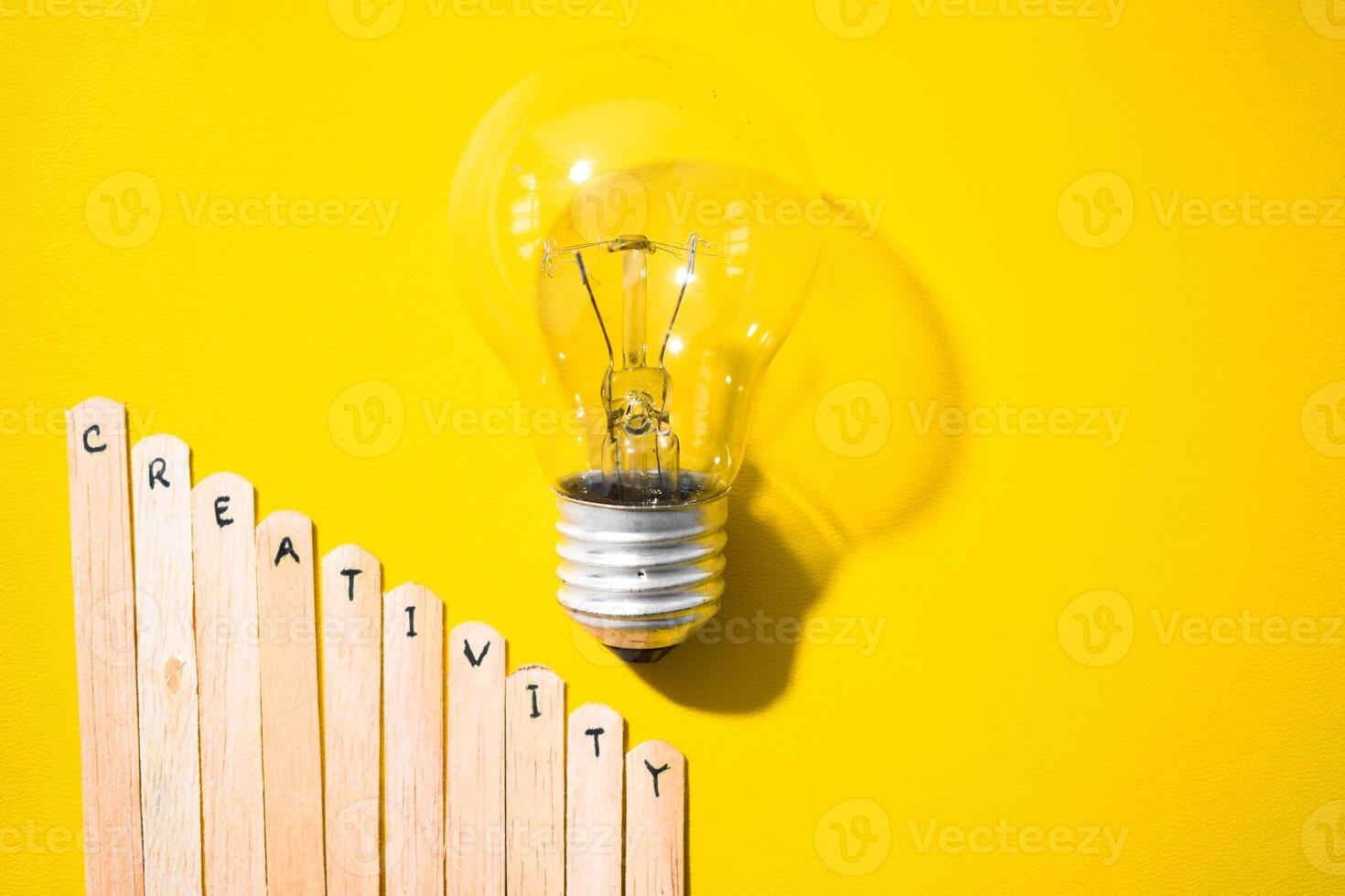 stick of ice cream with the words Creativity and lightbulb. Motivational quotes, optimism, positive words. Isolated on background photo