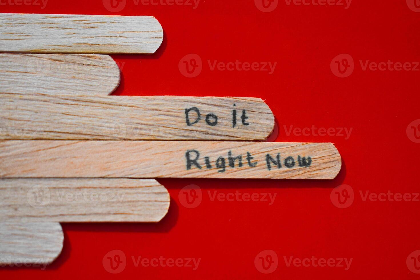 stick of ice cream with the words Do it right now. Motivational quotes, optimism, positive words. Isolated on background photo