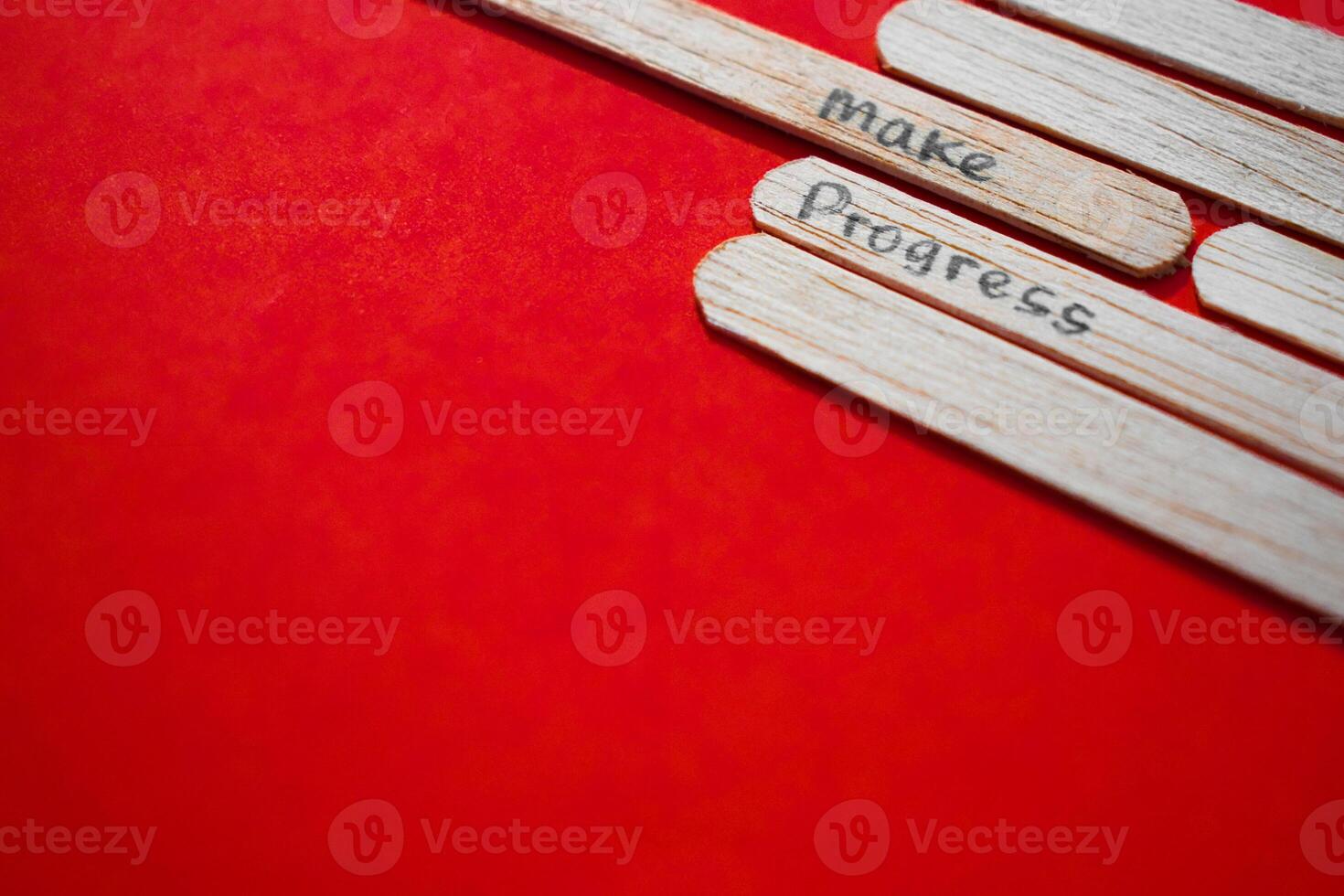 stick of ice cream with the words Make Progress. Motivational quotes, optimism, positive words. Isolated on background photo