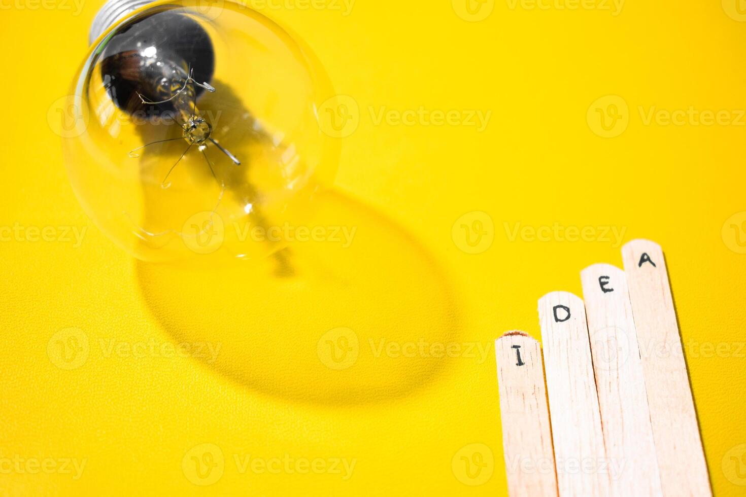 stick of ice cream with the words Idea and lightbulb. Motivational quotes, optimism, positive words. Isolated on background photo