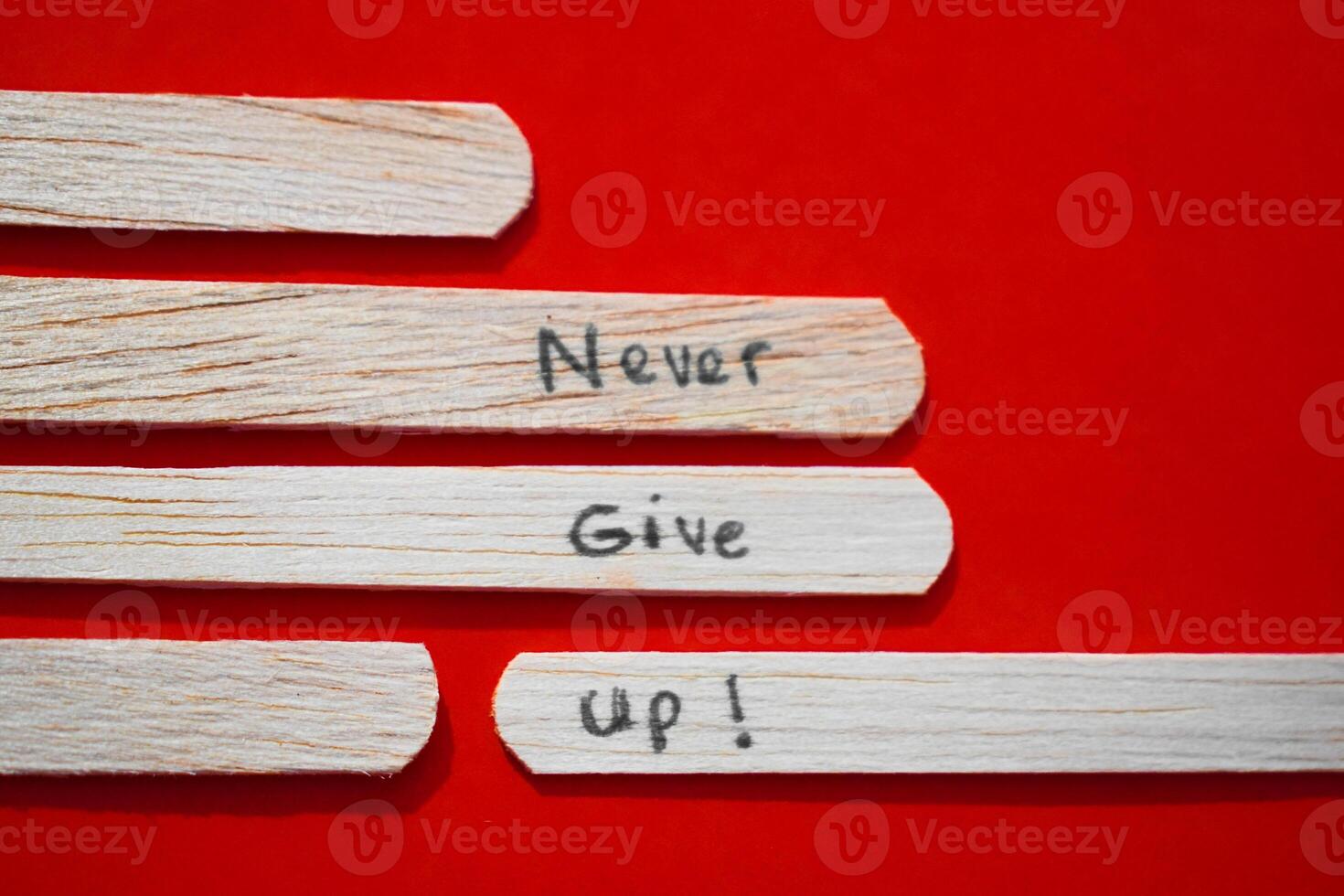 stick of ice cream with the words Never Give Up. Motivational quotes, optimism, positive words. Isolated on background photo
